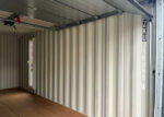 20-Fuß-Transportcontainer mit Garagen-Sektionaltoren – Bild 8
